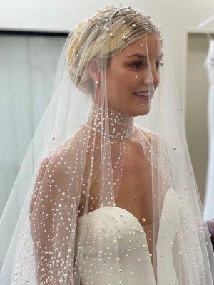 Our beautiful bride in our Lumi veil and Farrah cape.  2022 collection