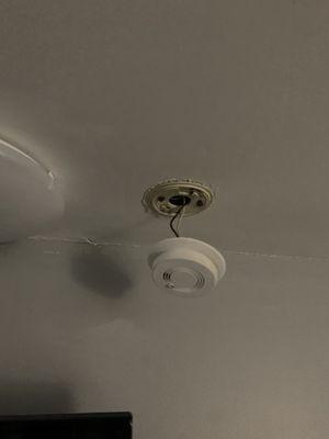 Hanging nonworking smoke detector