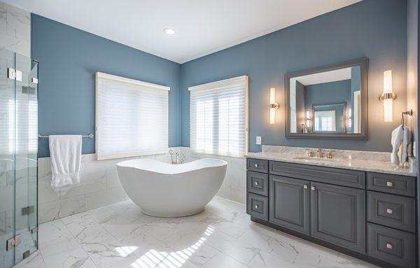 Medallion Cabinetry vanity cabinets. Happy floor Statuary 12x24 tiles. The vanity faucets are Kohler Forte. Kohlet Abrazo freestanding tub.