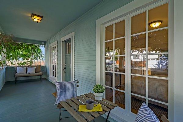 Fabulous covered porch for work, relaxing or people watching!