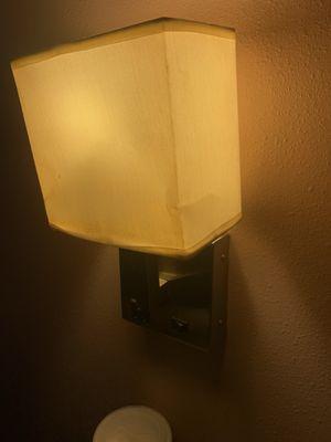 Mangled sconce shade.