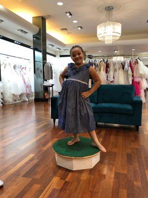 Modeling at a store Front to showcase children's gowns!