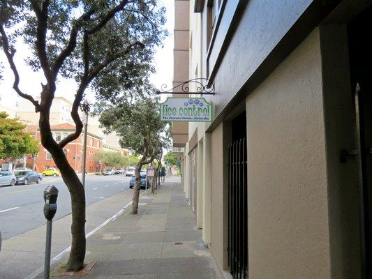 Valet parking is behind the salon where the sign is attached