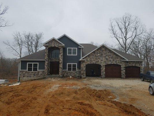 Custom home showing rock work.