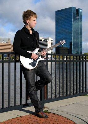 Male senior portrait on Toledo downtown riverfront