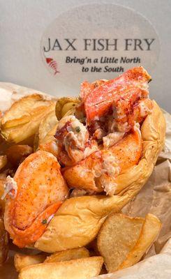 Lobsterlicious! (･‿･) Yes to chunks of tender lobster meat nestled in a warm soft roll @ #JaxFishFry-St. John's