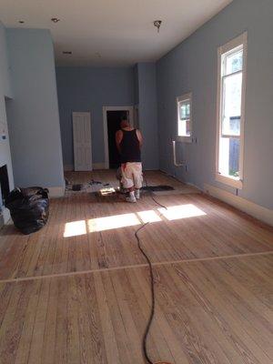 Walls painted; original hard wood floors sanded and stained