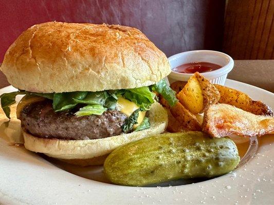 Cheeseburger with fries. Decent burger. Fries are great. Pickle is awesome.