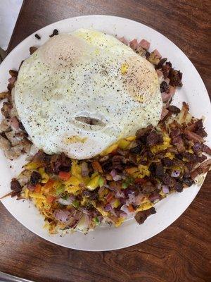 Loaded biscuits and gravy, 3 over easy eggs and loaded hash browns.