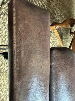 This is the worn area on the foot rest of a chair, in our vacation home, that has had about 4 months of actual usage days.