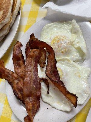 Bacon and sunny side up eggs that came with waffle - IG: @zachcoastalgreenberg