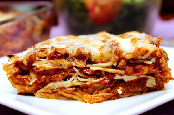 Pollo con Adobo - Adobo Chicken Enchiladas. Layers of corn tortillas, shredded chicken, adobo sauce, cream and cheese. Family favorite!