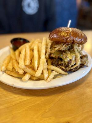 Smoky pulled pork sandwich on a pretzel bun