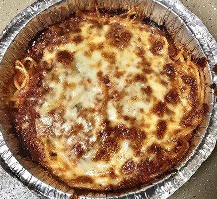 Spaghetti with Meat Sauce.  Love the crusty, gooey layer of meat sauce and cheese baked on top!