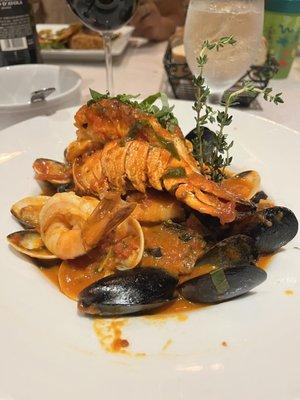 Squid Ink linguine with Lobster Tail and Seafood .  Special of the day. Perhaps less sauce would have enhanced the flavor of the seafood!