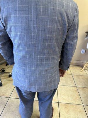 Before - the proper length of a sport coat or suit is that it terminates around the second knuckle when curled around the hem