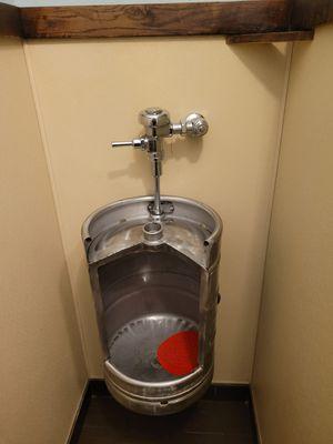 Innovation at its best. Turning a keg into a piss stall.