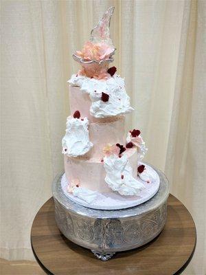 Contemporary meringue explosion cake with isomalt topper