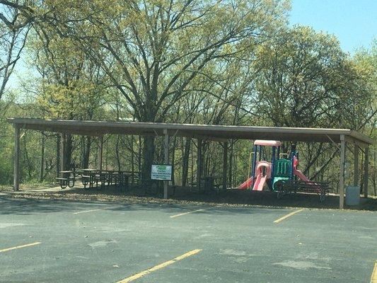 This is the "small pavilion."  It has about 8 picnic tables, a small grill, a playground and lots of parking.