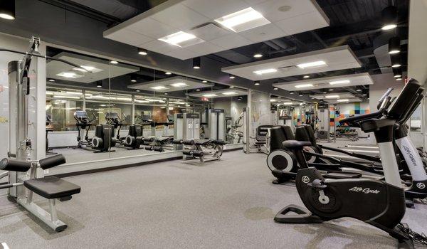 Fitness center features Fitness on Demand virtual fitness classes, cardio machines with personal TVs and resistance machines