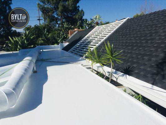 GAF Timberline shingle roof system with IB single-ply PVC flat roof.