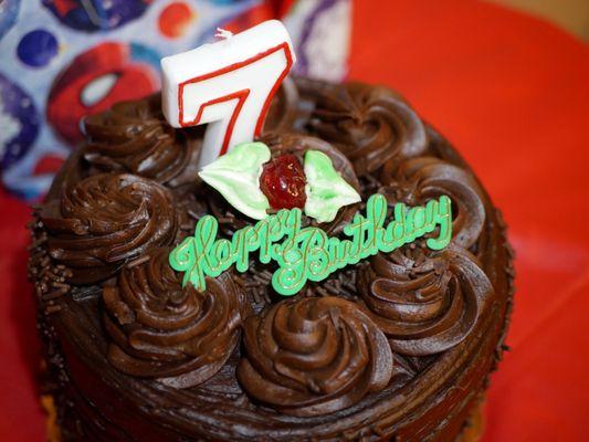 Chocolate fudge cake (1), with a birthday candle & topper. A last minute purchase for my nephew's party, turned out alright! (2/5/2020)