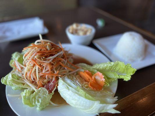 Papaya Salad (Som Tum) served with pork rinds and lettuce leaves!