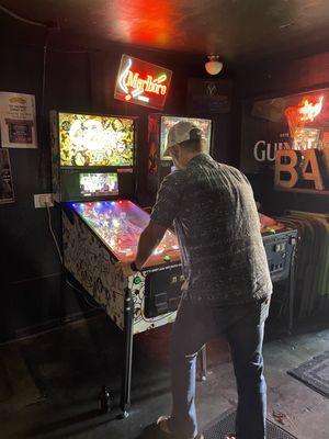 Buddy playing pinball.