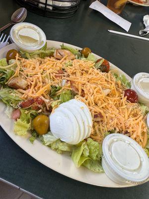 Grilled chicken salad with egg, peppers and lots of cheese