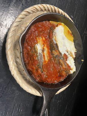 Sardine in tomato gravy sauce with fried egg, served with toasted bread