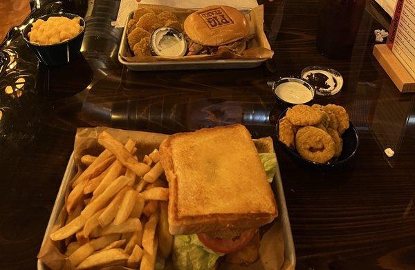 Fat Boy Sandwich and Barnyard Bourbon Pork with fried pickles, mac and cheese, and fries.