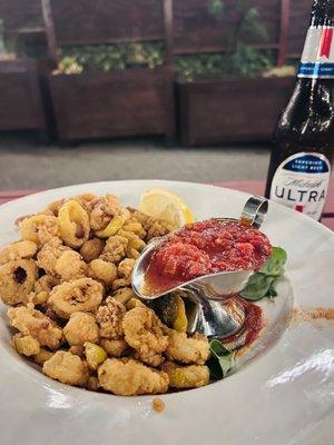 Flash fried with various peppers and served with a spicy marinara sauce, this is one of the best variations of calamari I've ever had.