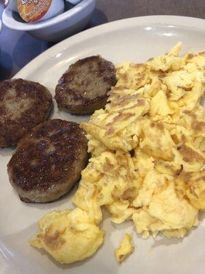 Hard scrambled eggs ( hubby likes them that way ) and their homemade sausage patties. Yummy!