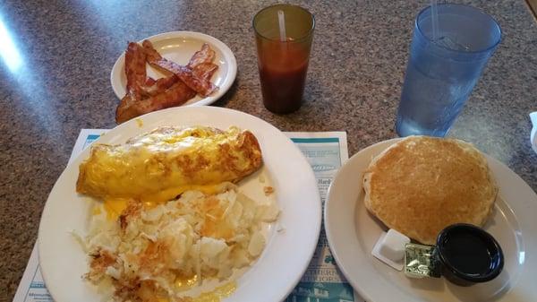 Egg and cheese omelet bacon hash brown and pancakes