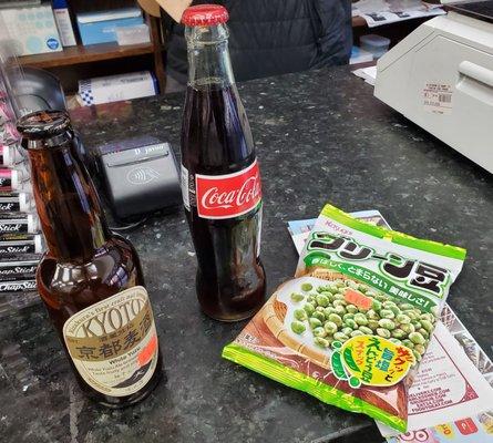 Coca cola in a glass bottle, Kyoto White yuzu (Kizakura's first craft malt beverage), and Kasugai green peas packet