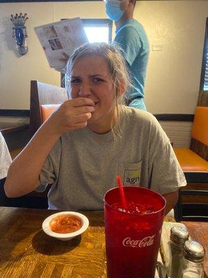 The sister of the greatest softball coach eating chips