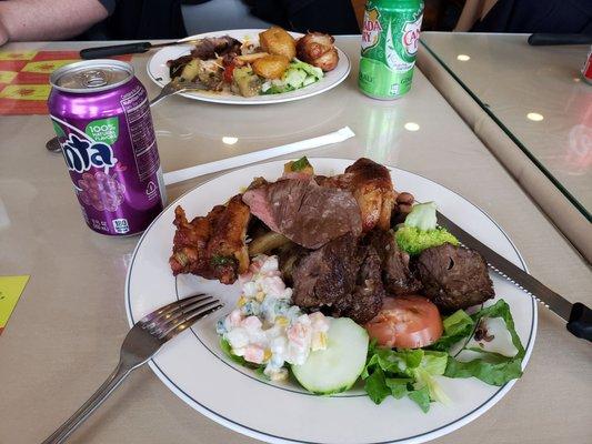 My plate during lunch with different salad and meat.