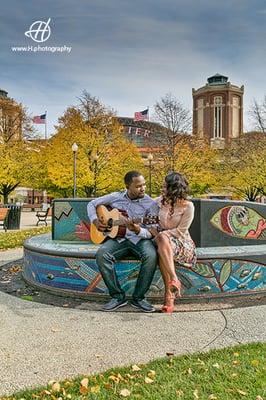 Tobi and Ola singing at Navy Pier for their engagement session