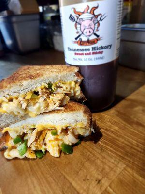 Buffalo chicken mac-n- grilled cheese! Smoked pulled chicken, Buffalo sauce, American cheese, smoked gouda mac, jalapeños on Texas Toast.