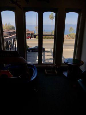 My son loves watching the cars go by and mama loves the ocean view :-)