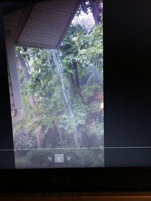 photo of the video I have of rain pouring down my roof.