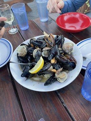 Sautéed clams and mussels over garlic bread