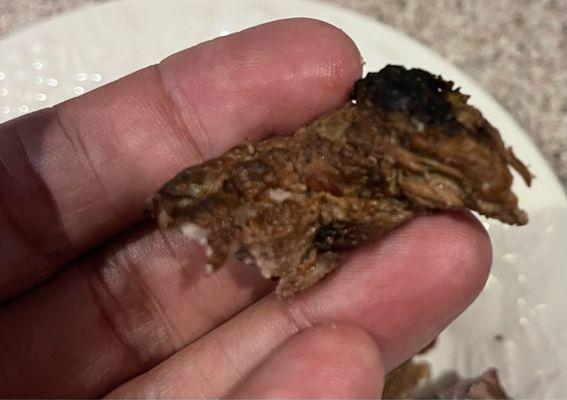 One small piece of carne asada. Certainly not rare. Tough and dry, albeit flavorful (jerky, anyone?). Maybe next time.