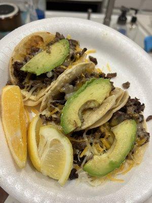 Tacos with Asada, cheese and avocado. The meat had such good flavor and was cooked perfectly!