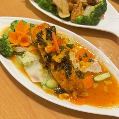 Salmon Fillet - Cooked to temperature with vegetables in a mango glaze and served with jasmine rice.