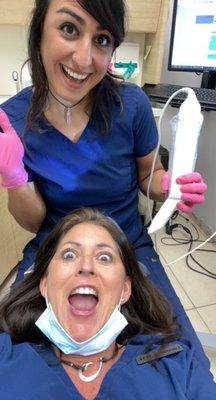 Our hygiene assistant attempting to scan one of our hygienists, Larissa!