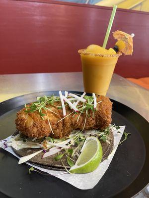 Crispy (GF) Cod on a Blue Corn Tortilla with Slaw, Creamy Chipotle and Microgreen Cilantro.