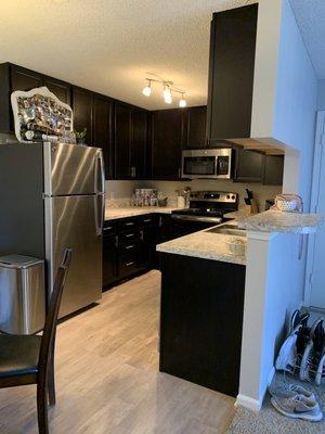 Our kitchen in our remodeled one bedroom apartment.