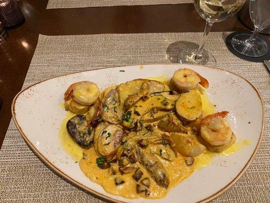 Shrimp and scallops with saffron cream sauce. Couldn't detect any saffron. Both scallops and shrimp cooked perfectly though.