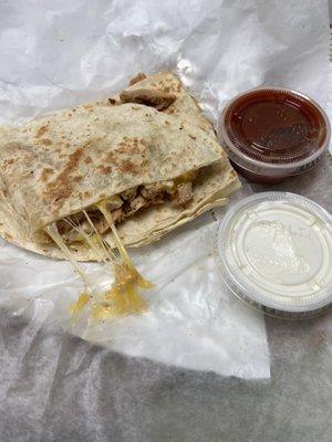 Chicken quesadilla with sour cream and salsa (included)